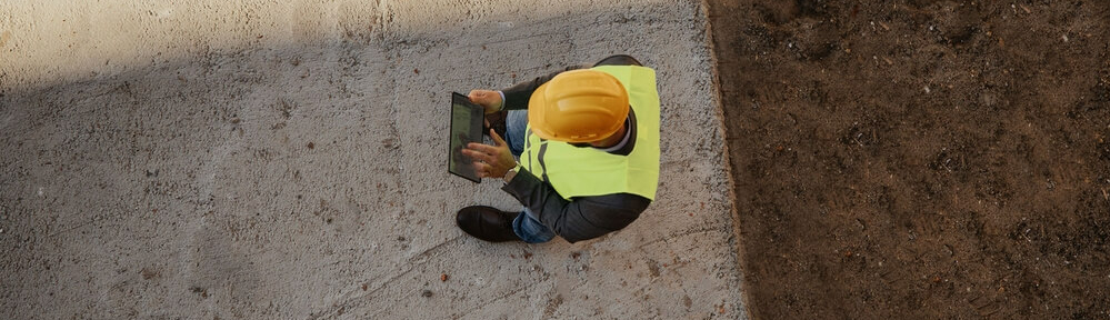 Construction worker reviewing documents